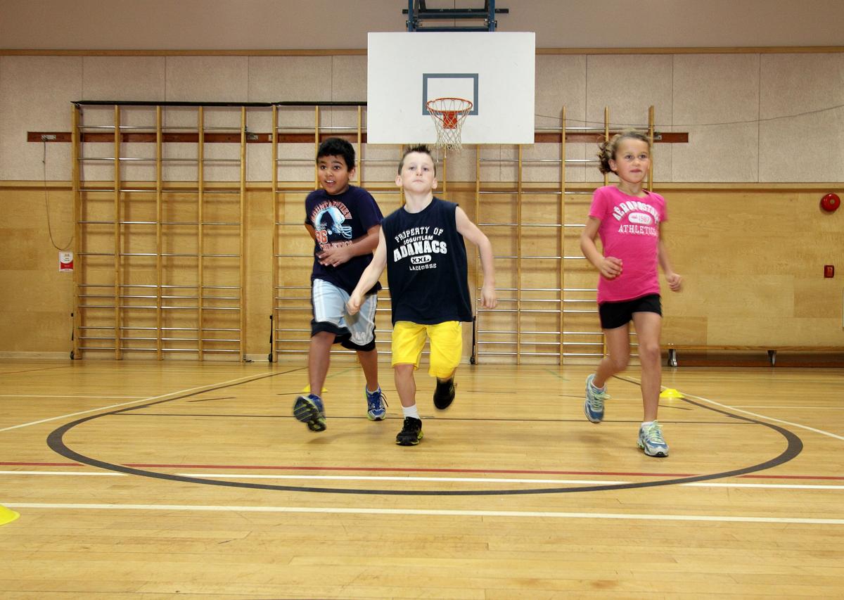 three young children running in a line